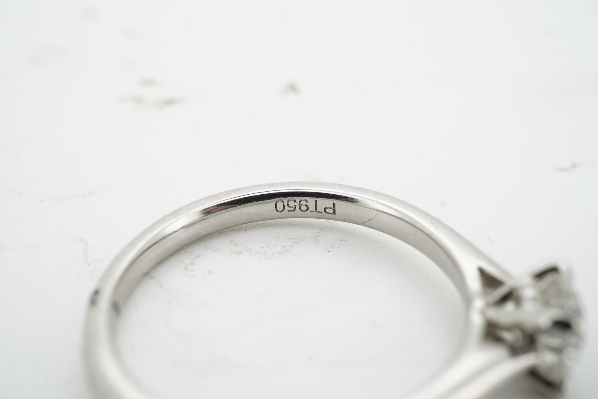 A diamond ring, claw-set with a brilliant-cut diamond weighing approximately 0.57 carats, mounted in platinum, size M, British hallmarks, gross weight approximately 3 grams